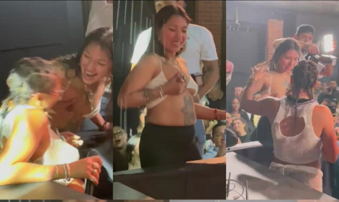 Tokischa bebiendo leche de una fanatica